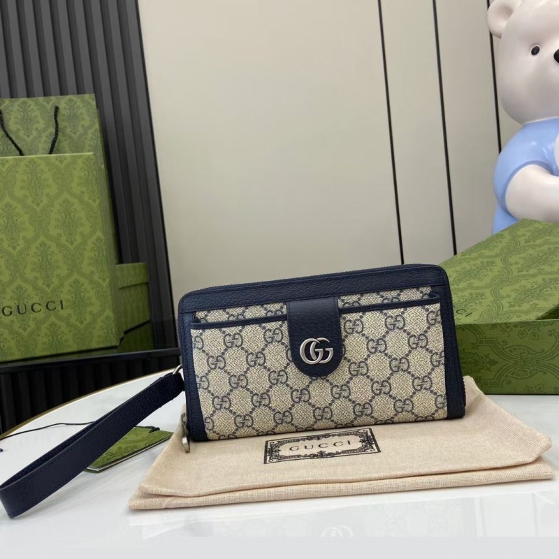 G*u*i clutch bags
